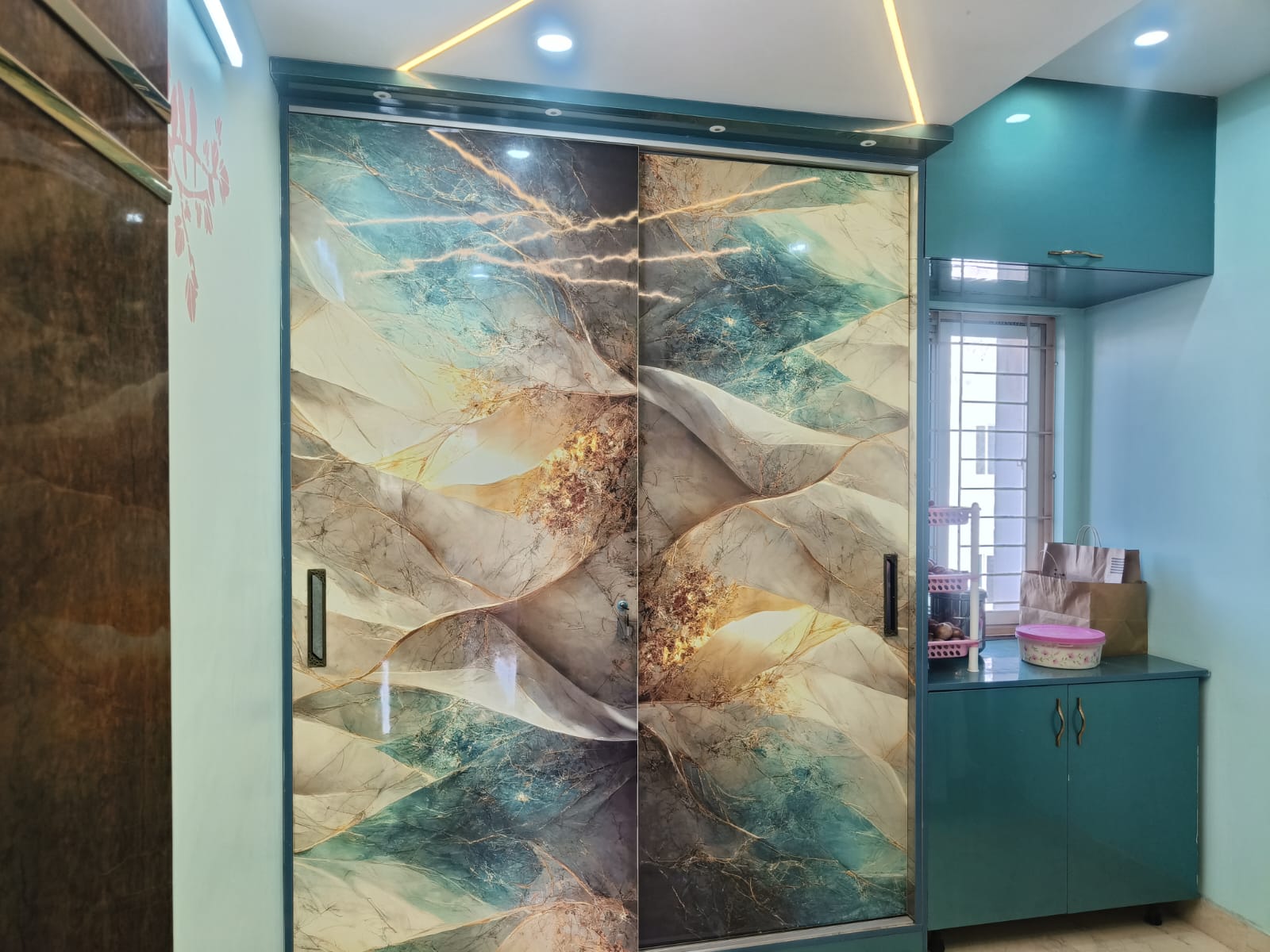 Walk-in glass door wardrobe with warm interior LED shelves